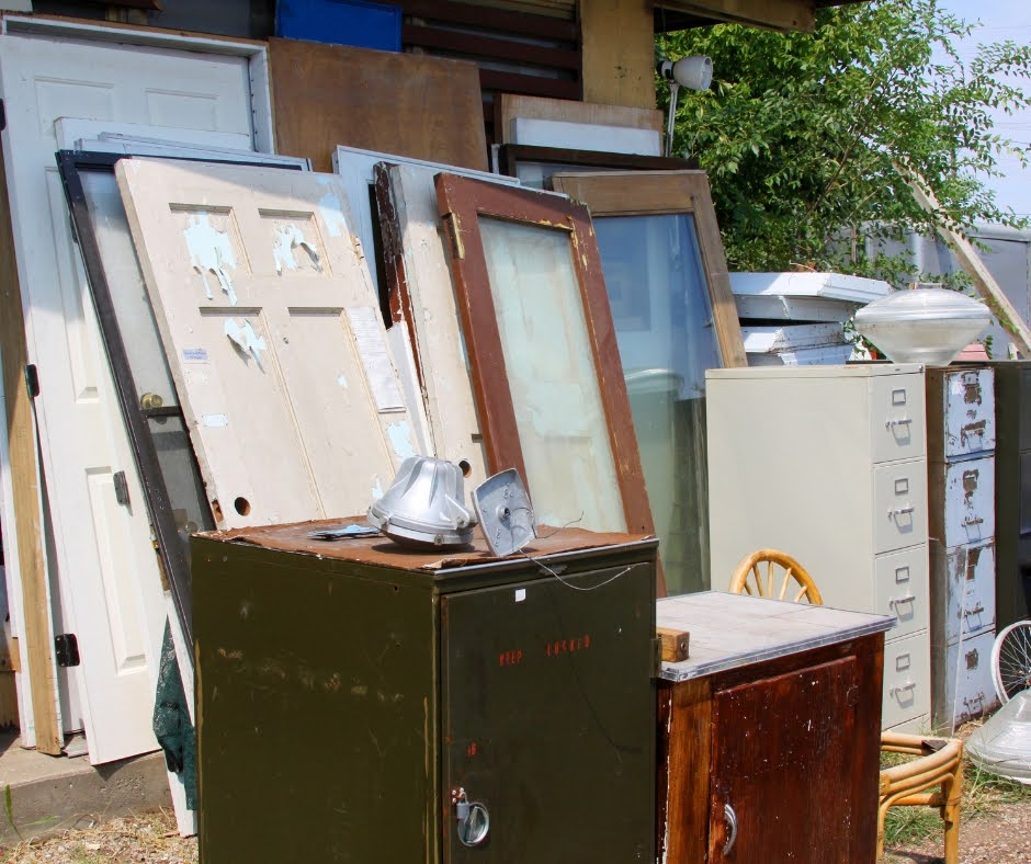 Commercial junk ready for pickup – Tampa office junk removal with discarded items prior to renovation. Office furniture hauling project with The Site Masters