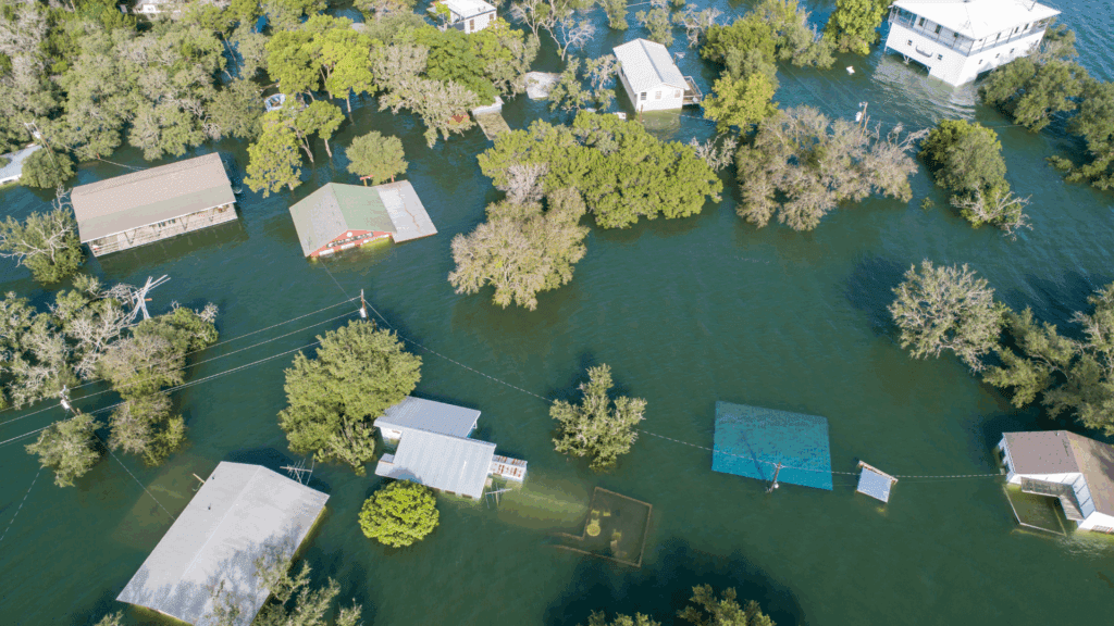Aerial view of a flooded neighborhood in Tampa Bay, showing the need for post-storm and hurricane debris removal services.